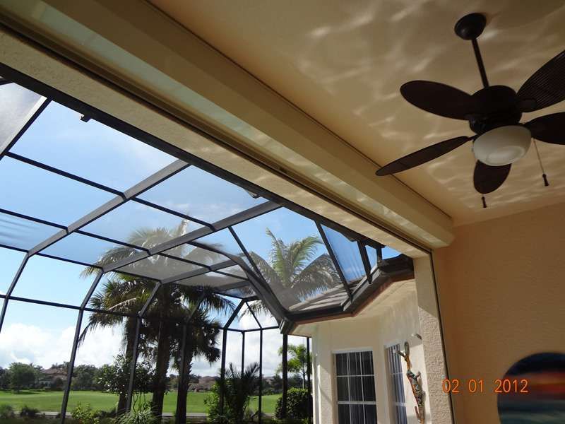 A Ceiling Fan Is Hanging From the Ceiling of a Room — Naples, FL — Wind Safe Shutters LLC