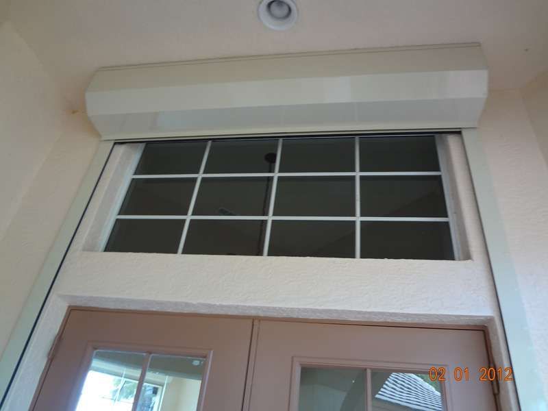 A Picture of a Door With a Window Above It — Naples, FL — Wind Safe Shutters LLC