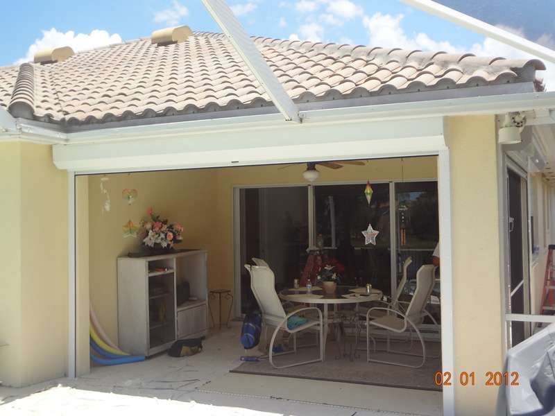 A Picture of a Patio With a Table and Chairs Taken On January 12 2012 — Naples, FL — Wind Safe Shutters LLC