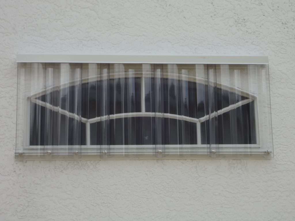 A Window With a Clear Plastic Covering on It — Naples, FL — Wind Safe Shutters LLC