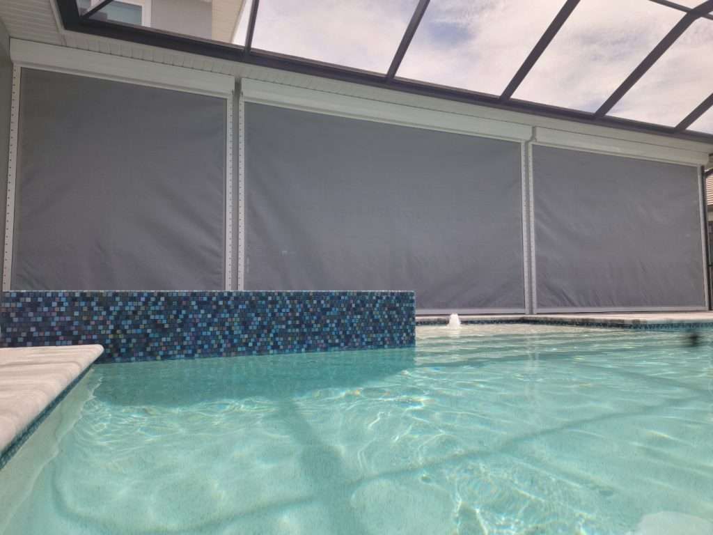 A Swimming Pool With a Canopy Over It and a Lot of Water — Naples, FL — Wind Safe Shutters LLC