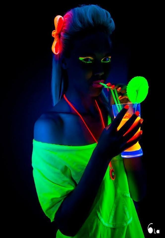 A woman wearing glow in the dark dress