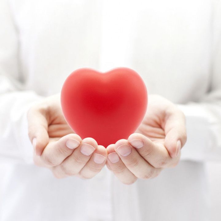 Woman is Holding a Red Heart