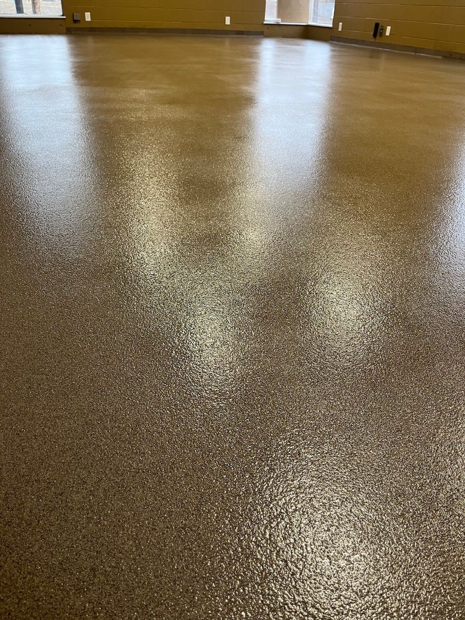 A close up of a shiny floor in a room.