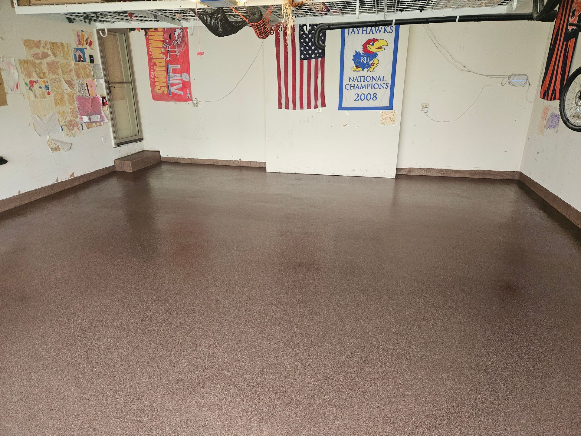 A garage with a sign that says kansas state on it