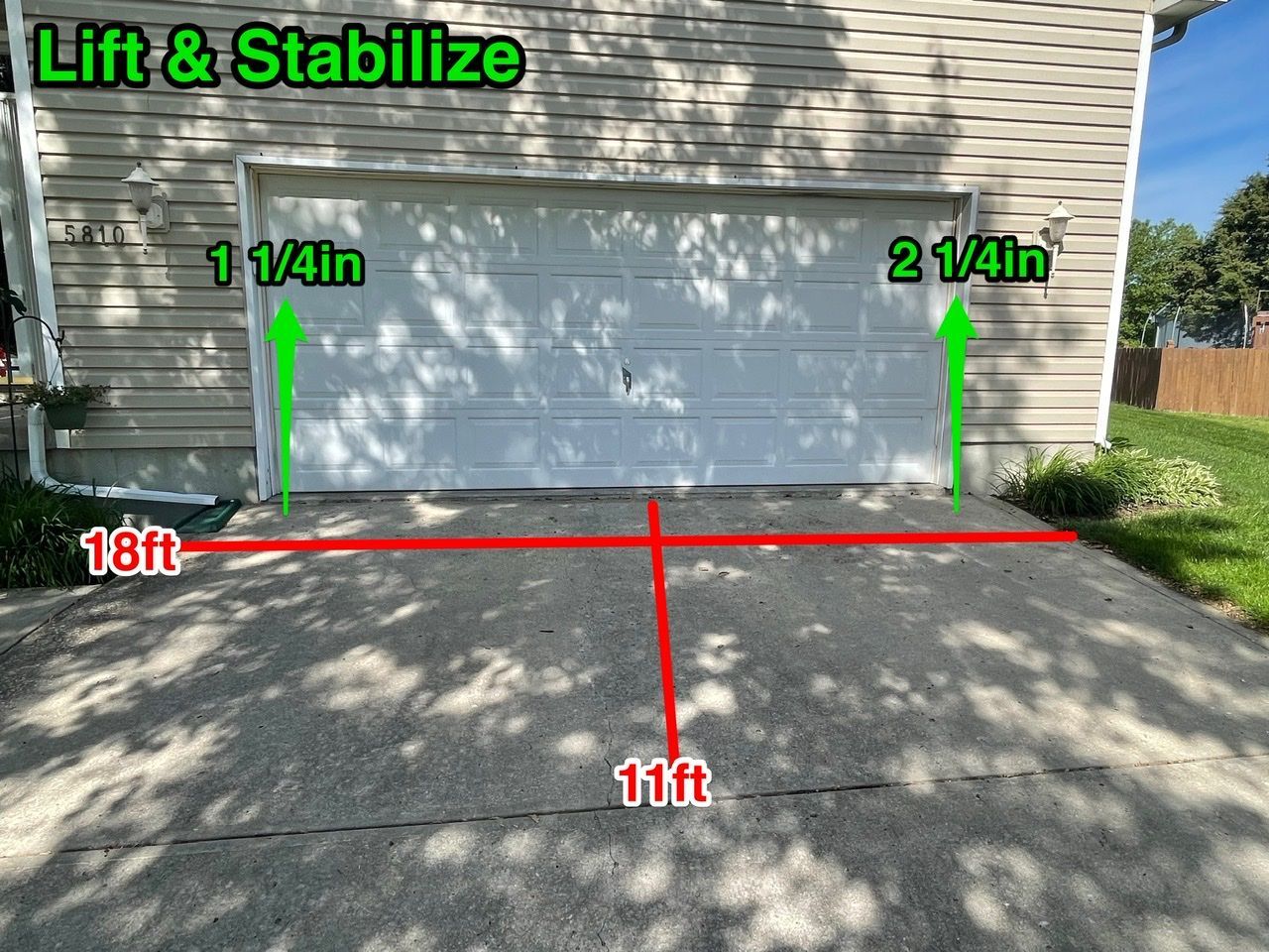 A picture of a garage door being lifted and stabilized.