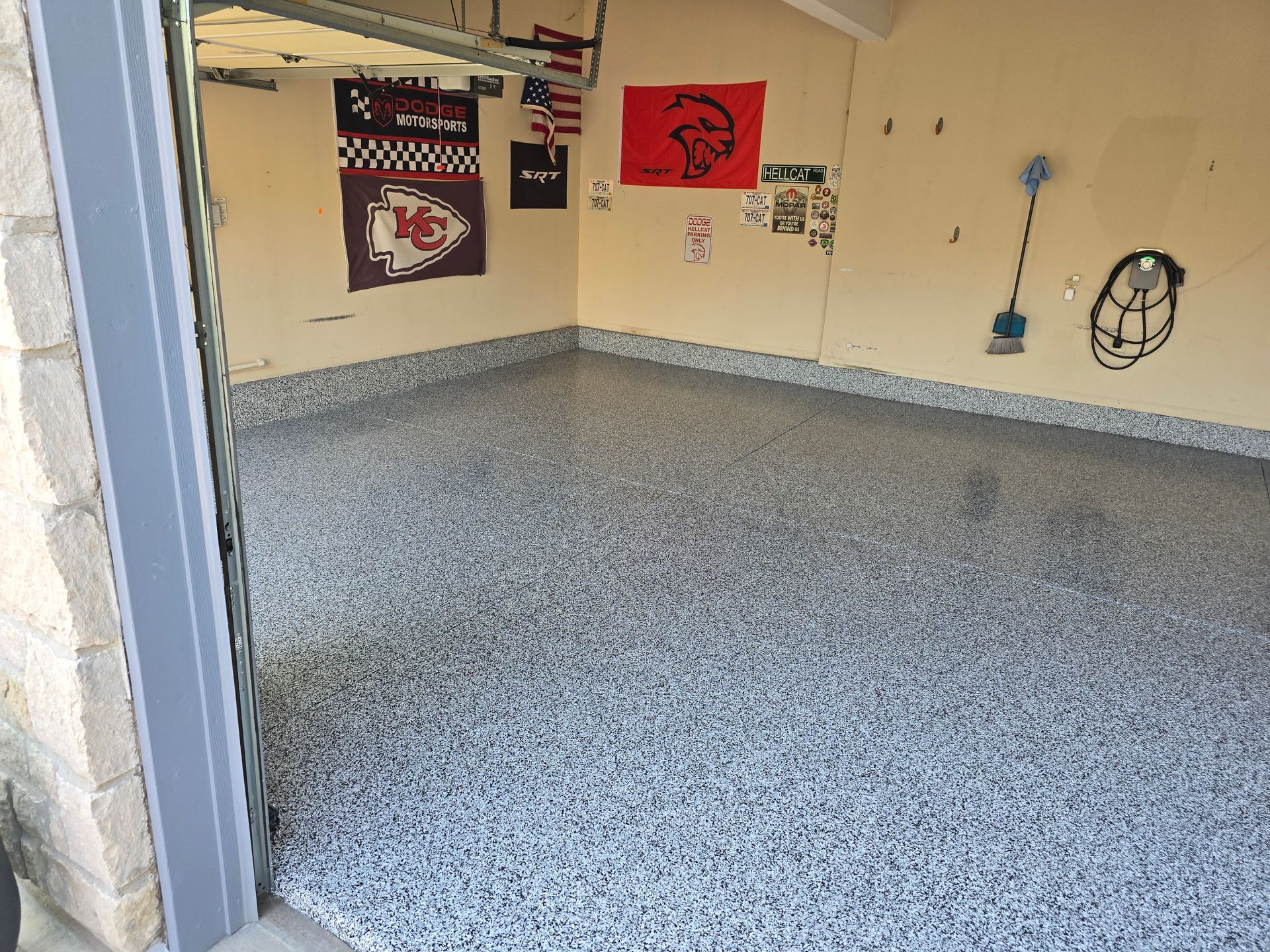 A garage with a flag on the wall and a flag on the floor.