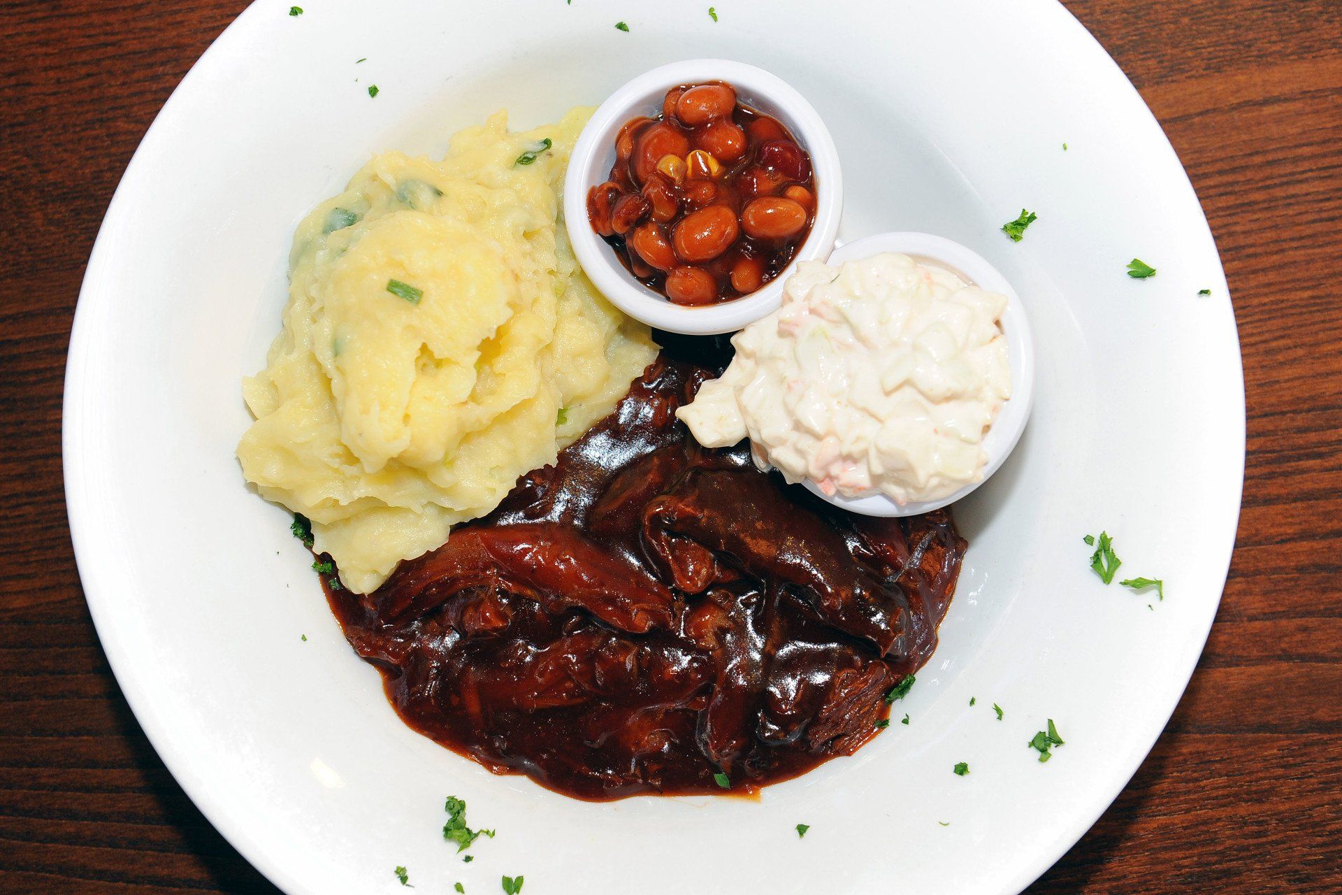 Top view of a dish containing mashed potatoes, beans at Abbotsinch