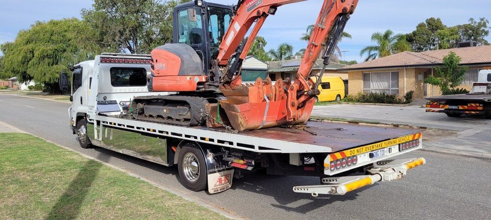 excavator being transported