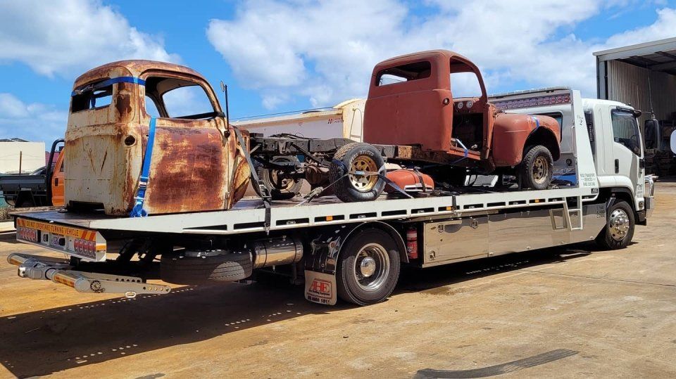 old vehicle parts being transported