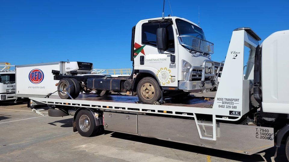 mini truck being transported