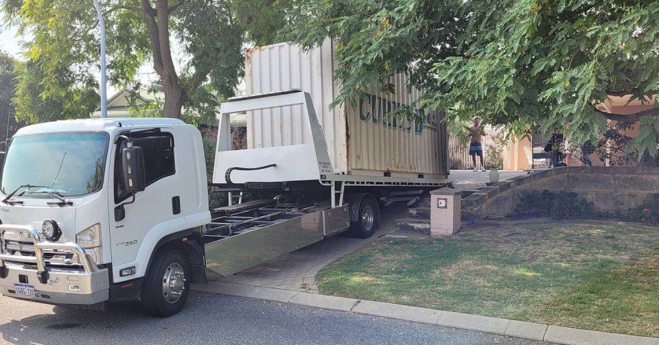 transportation truck loading a container