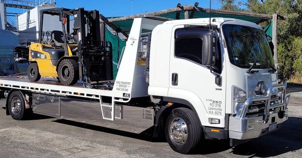 forklift crane being transported