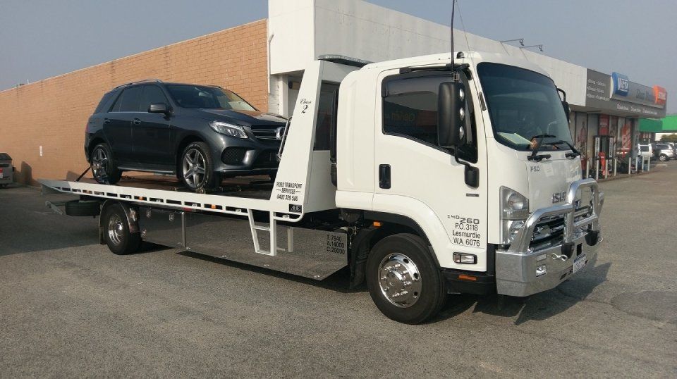 view of a black SUV being transported