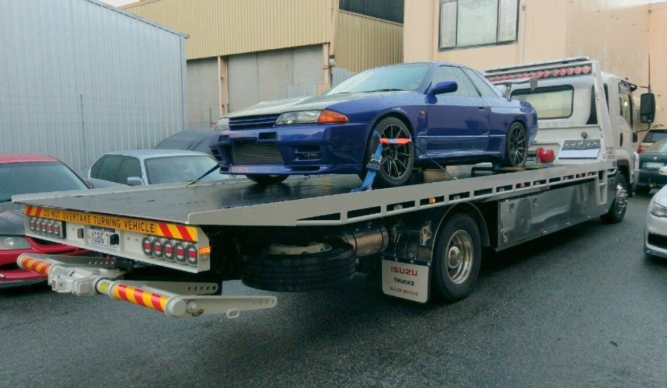 blue car being transported