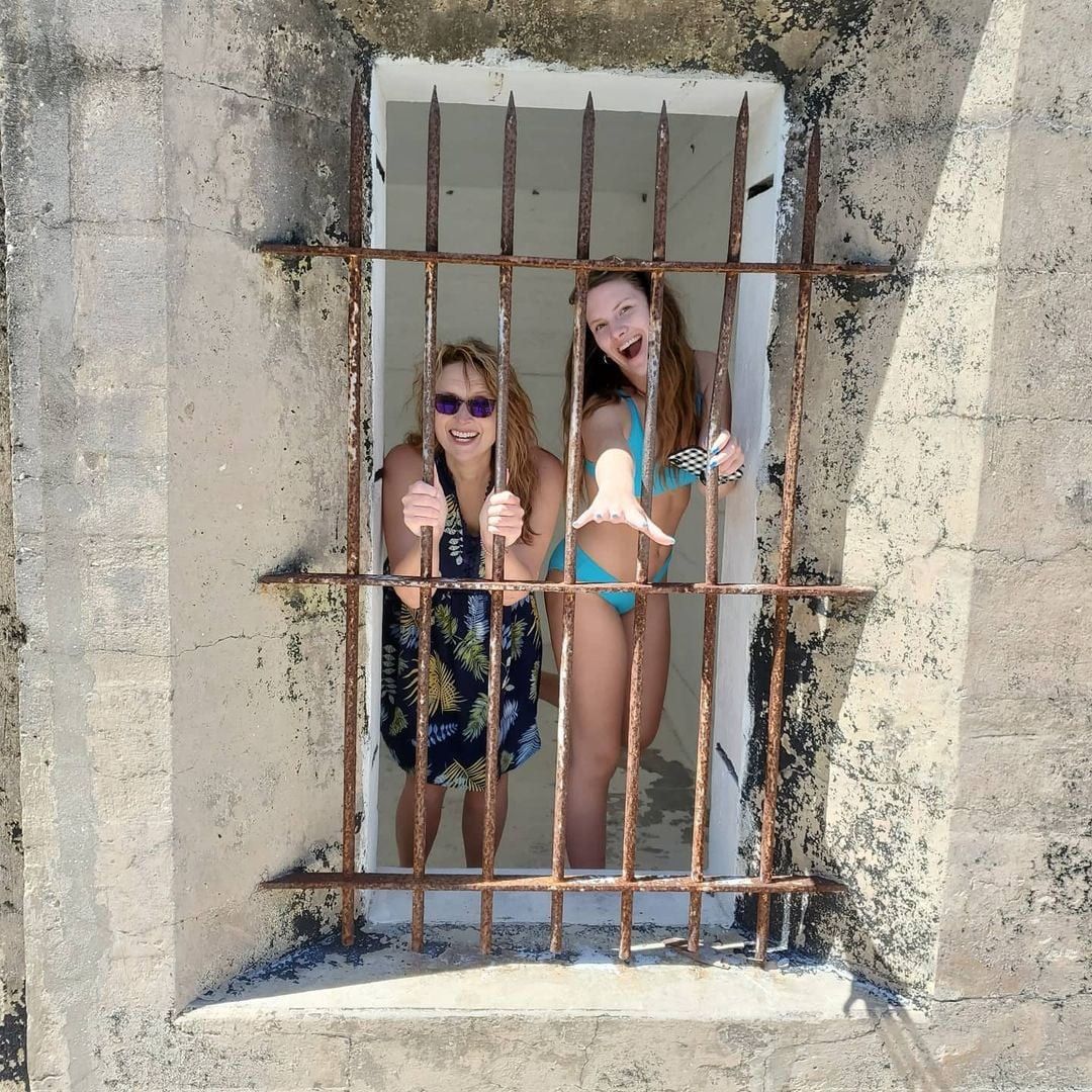 Two women in jail rails