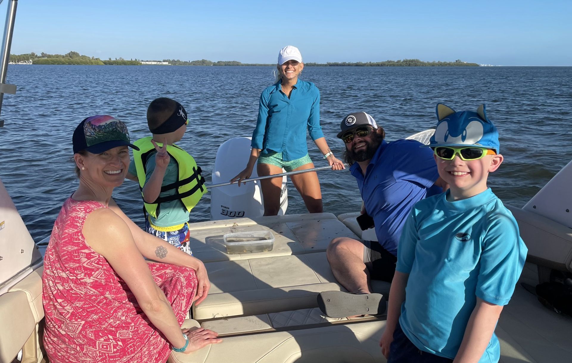 people on a boat smiling 