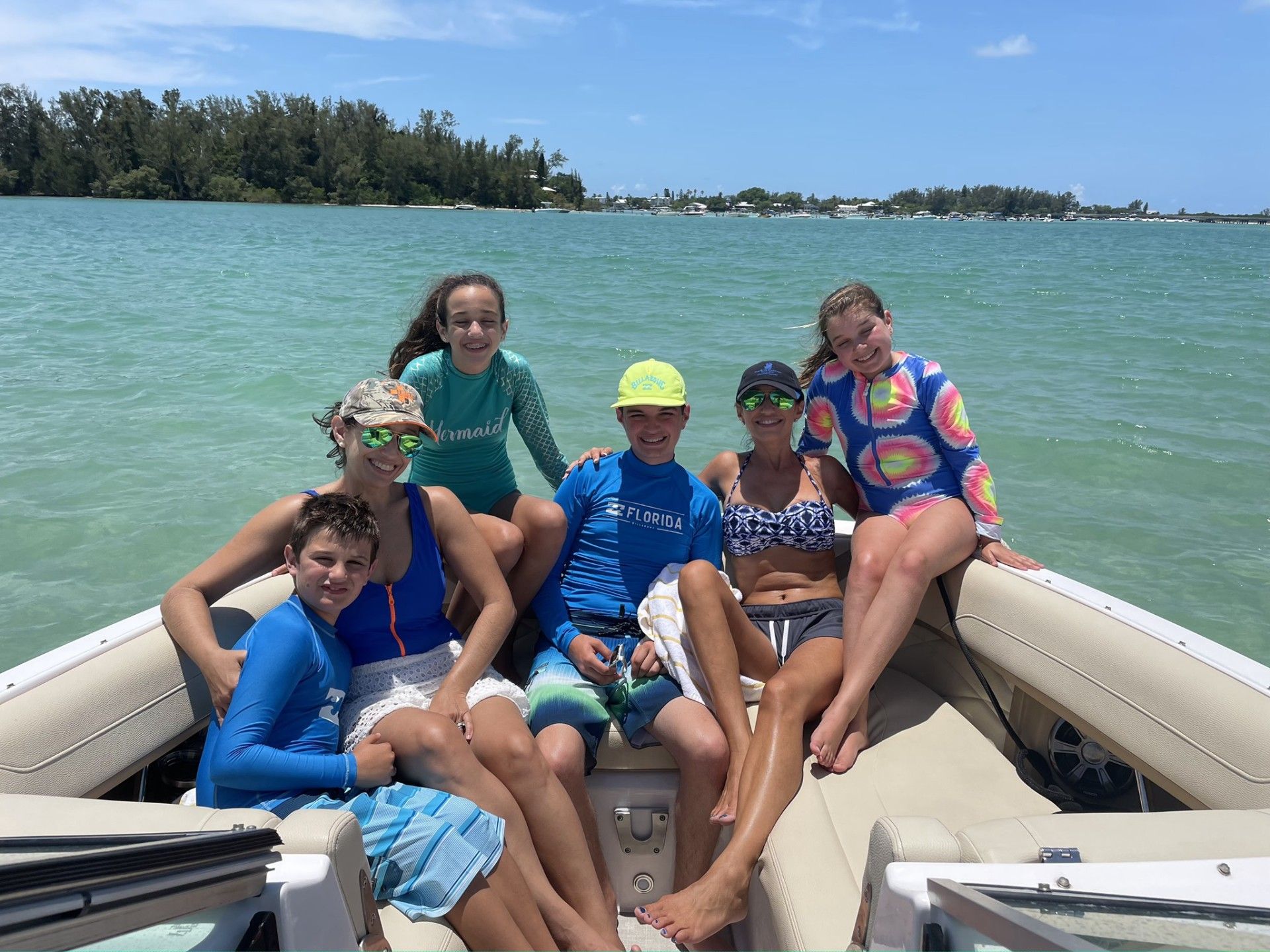 Happy family are sitting on a boat
