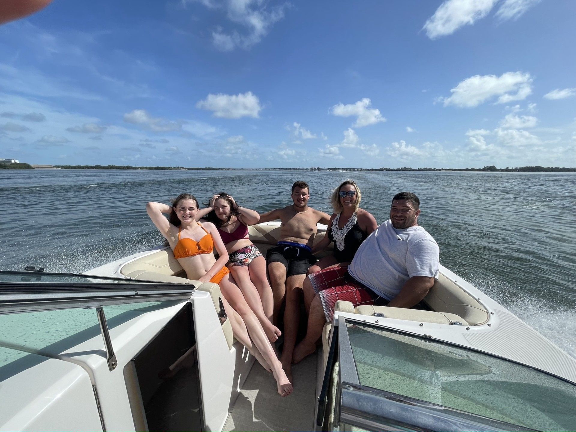 a family enjoying themselves on a boat in florida