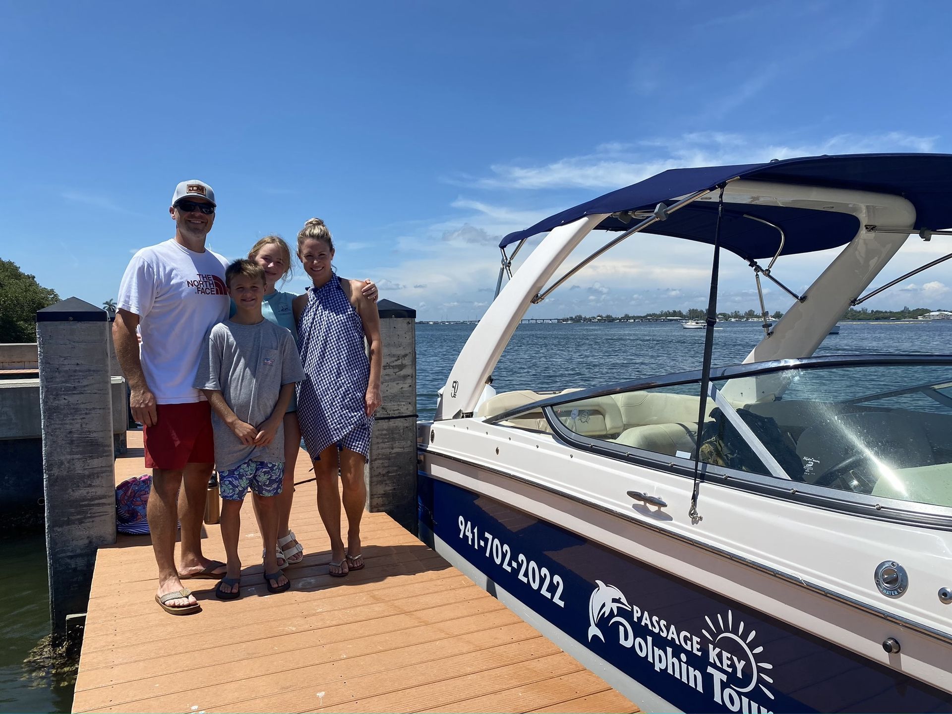 A group of people are sitting on a boat in the water.