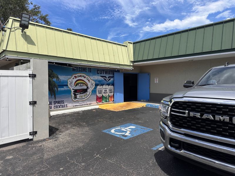 Exterior of a business with a light green roof