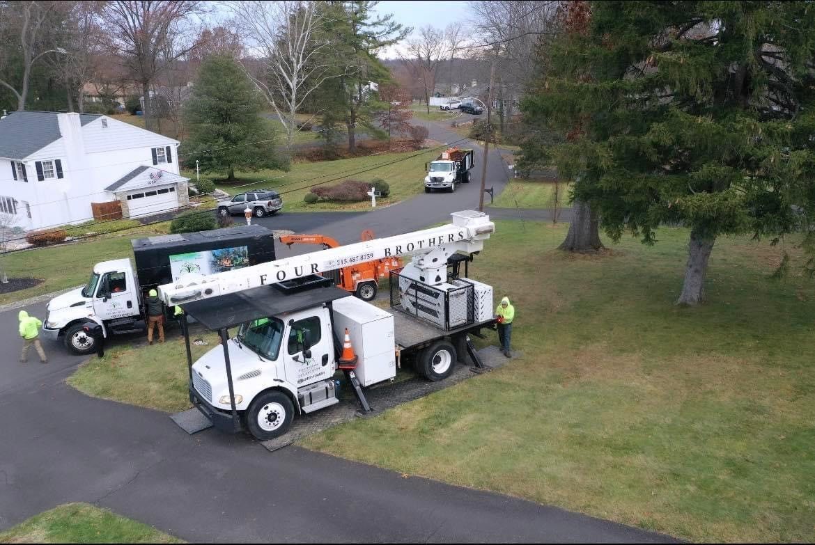An aerial view of a truck parked in a driveway next to a house.