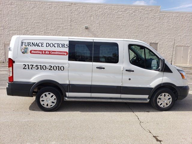 Residential Furnaces — Repairman Fixing Air Conditioning System in Champaign, IL