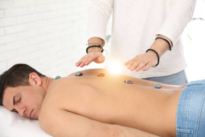 hot stone and reiki session for man back