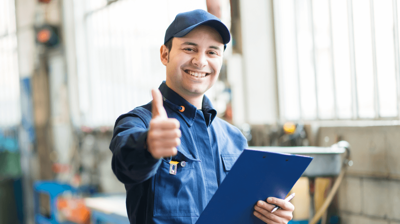 a happy mechanic giving a thumbs up