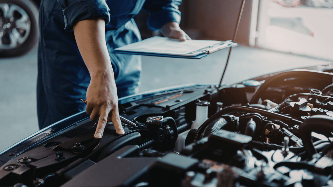 a mechanic doing a pre-purchase vehicle inspection