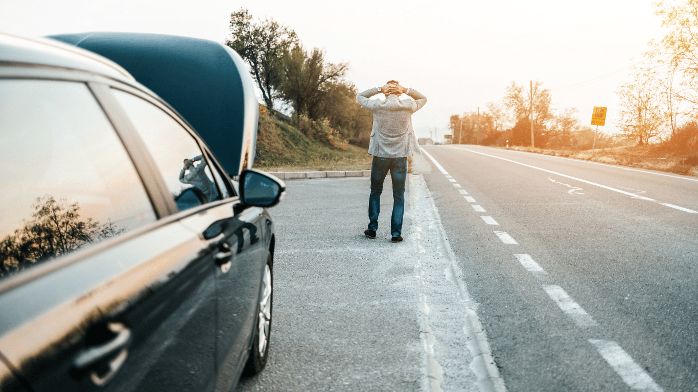a broken down vehicle with a stranded driver