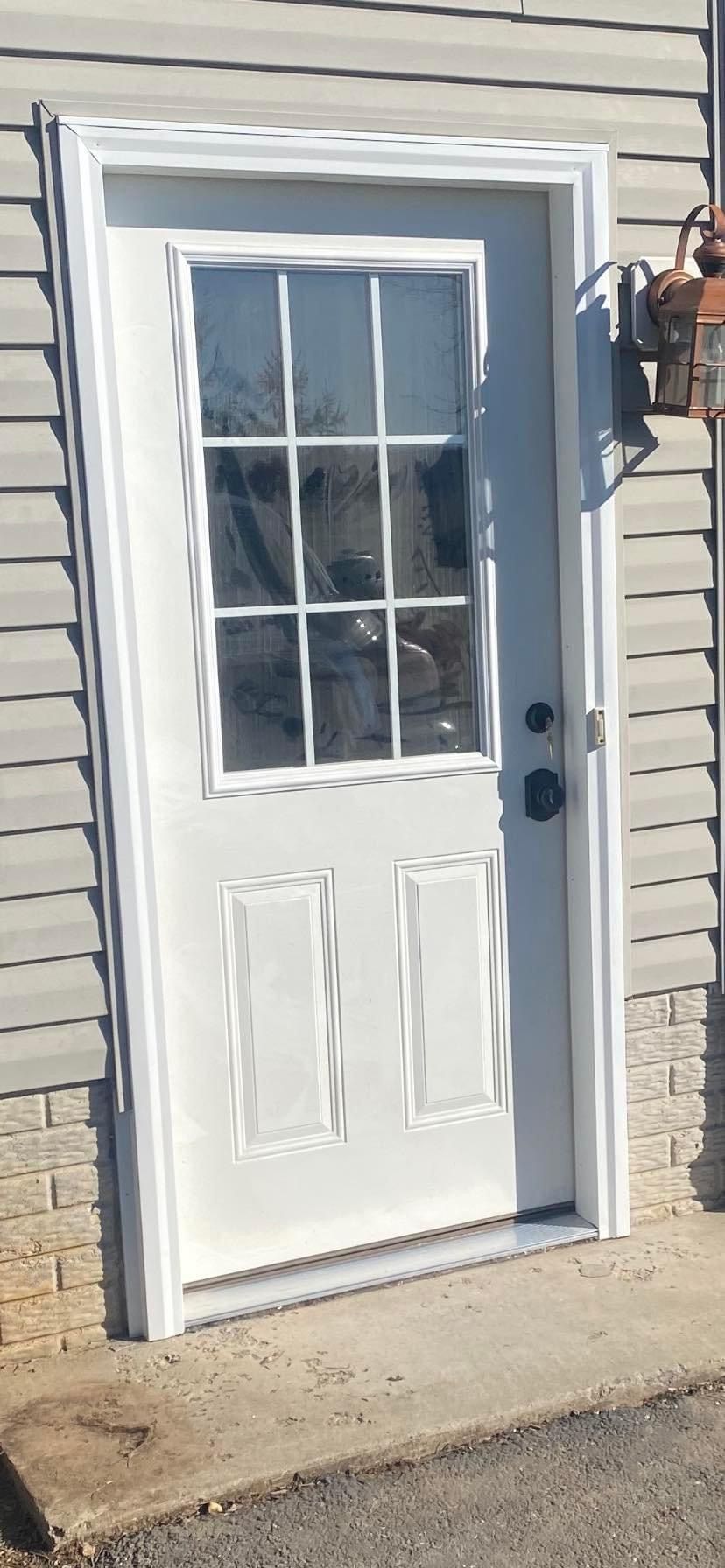 A white door with a window on the side of a house — KP's Home Repair — McGaheysville, VA