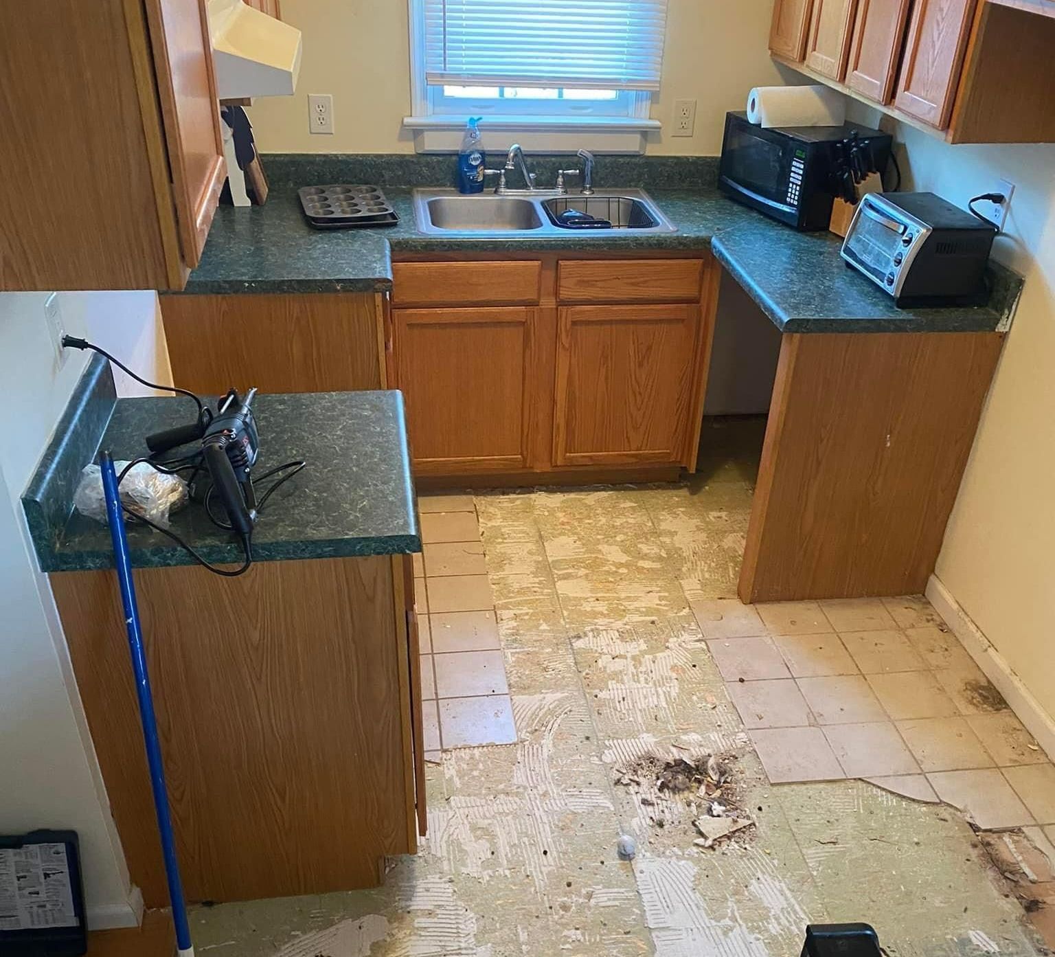 A kitchen with a sink a microwave and a toaster oven — KP's Home Repair — McGaheysville, VA