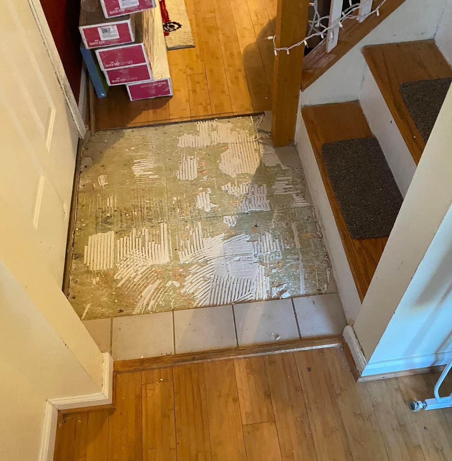 A hallway with a wooden floor and stairs — KP's Home Repair — McGaheysville, VA