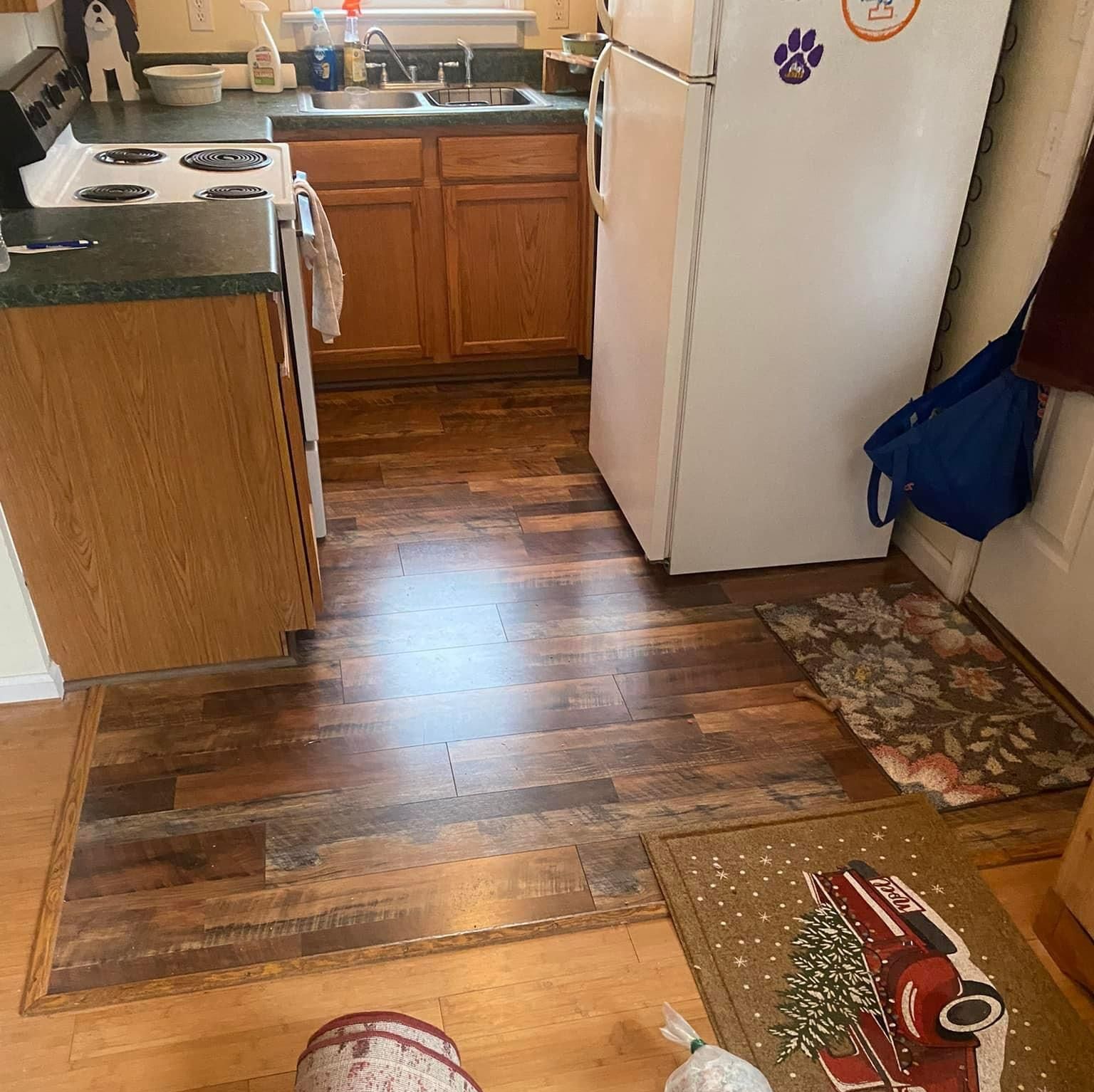 A kitchen with wooden floors and a white refrigerator — KP's Home Repair — McGaheysville, VA