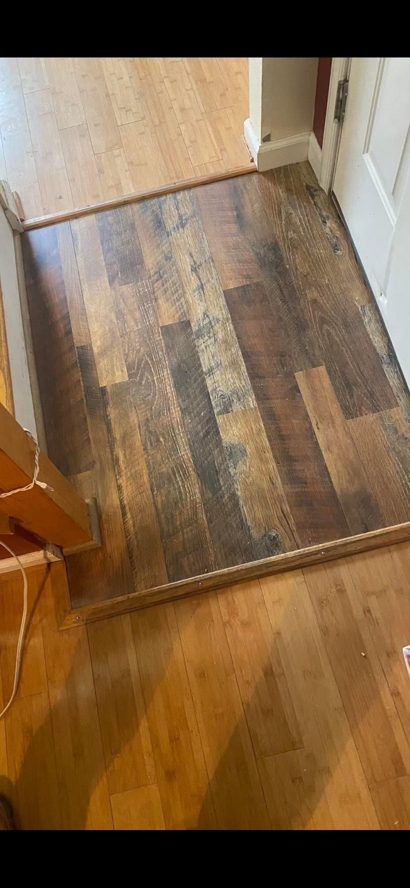 A wooden floor in a room next to a door — KP's Home Repair — McGaheysville, VA