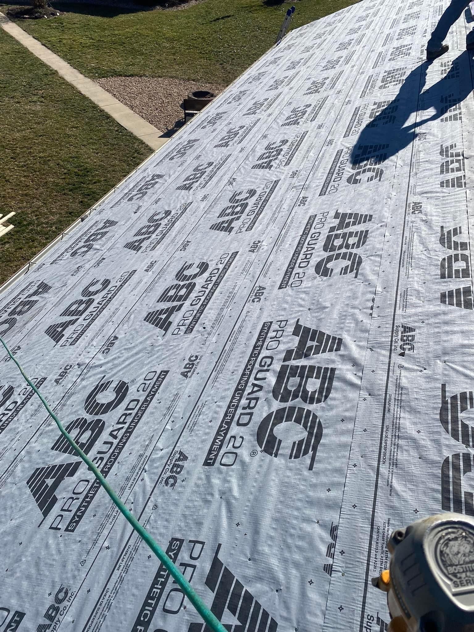 a large piece of roofing material is sitting on top of a roof — KP's Home Repair — McGaheysville, VA