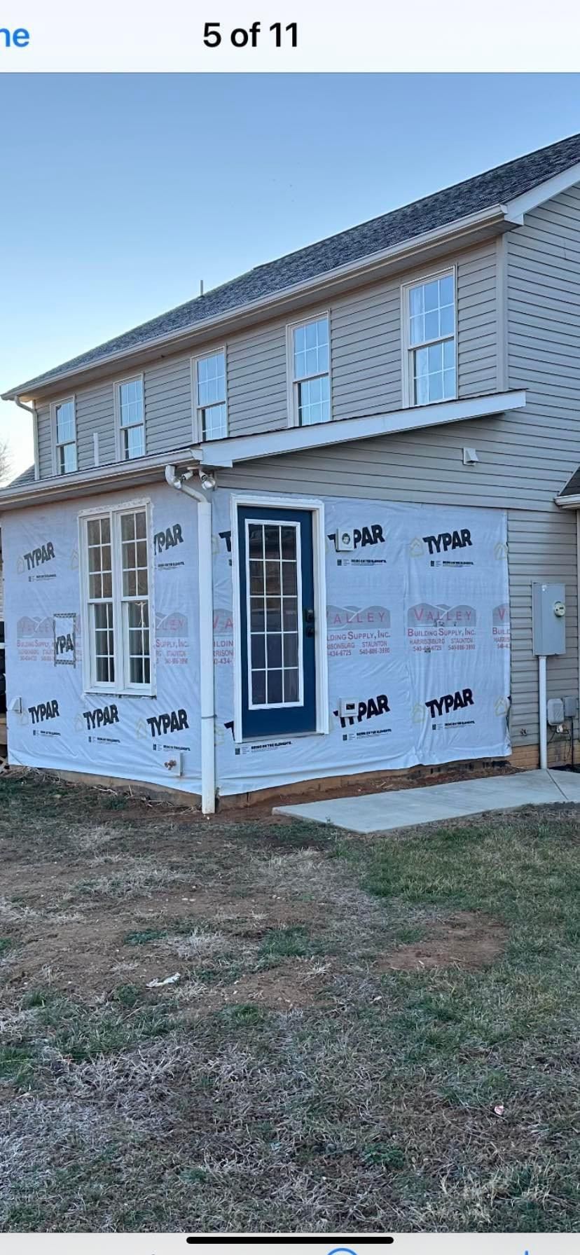 A house with a blue door and windows is being remodeled — KP's Home Repair — McGaheysville, VA