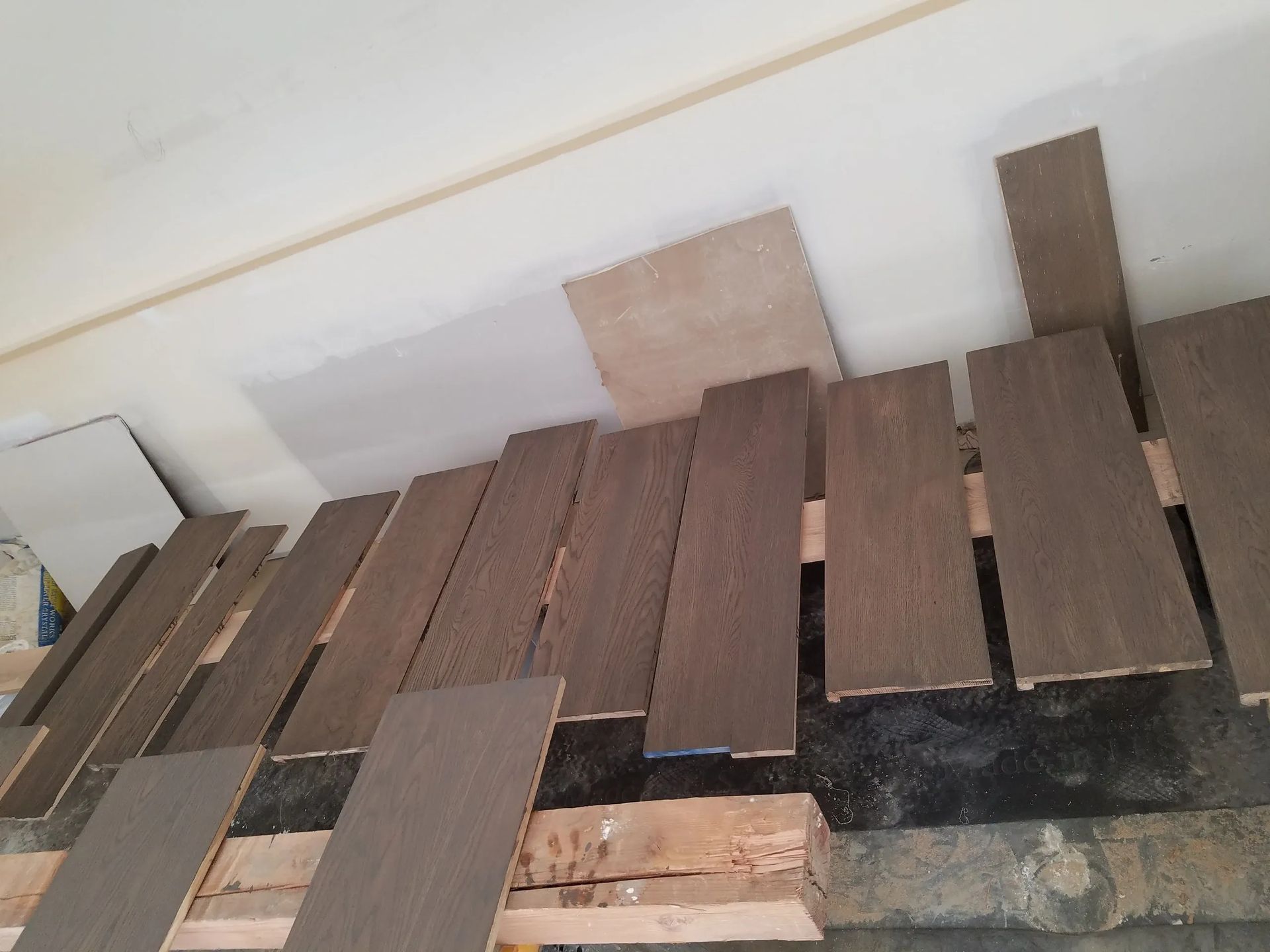 A bunch of wooden boards are stacked on top of each other