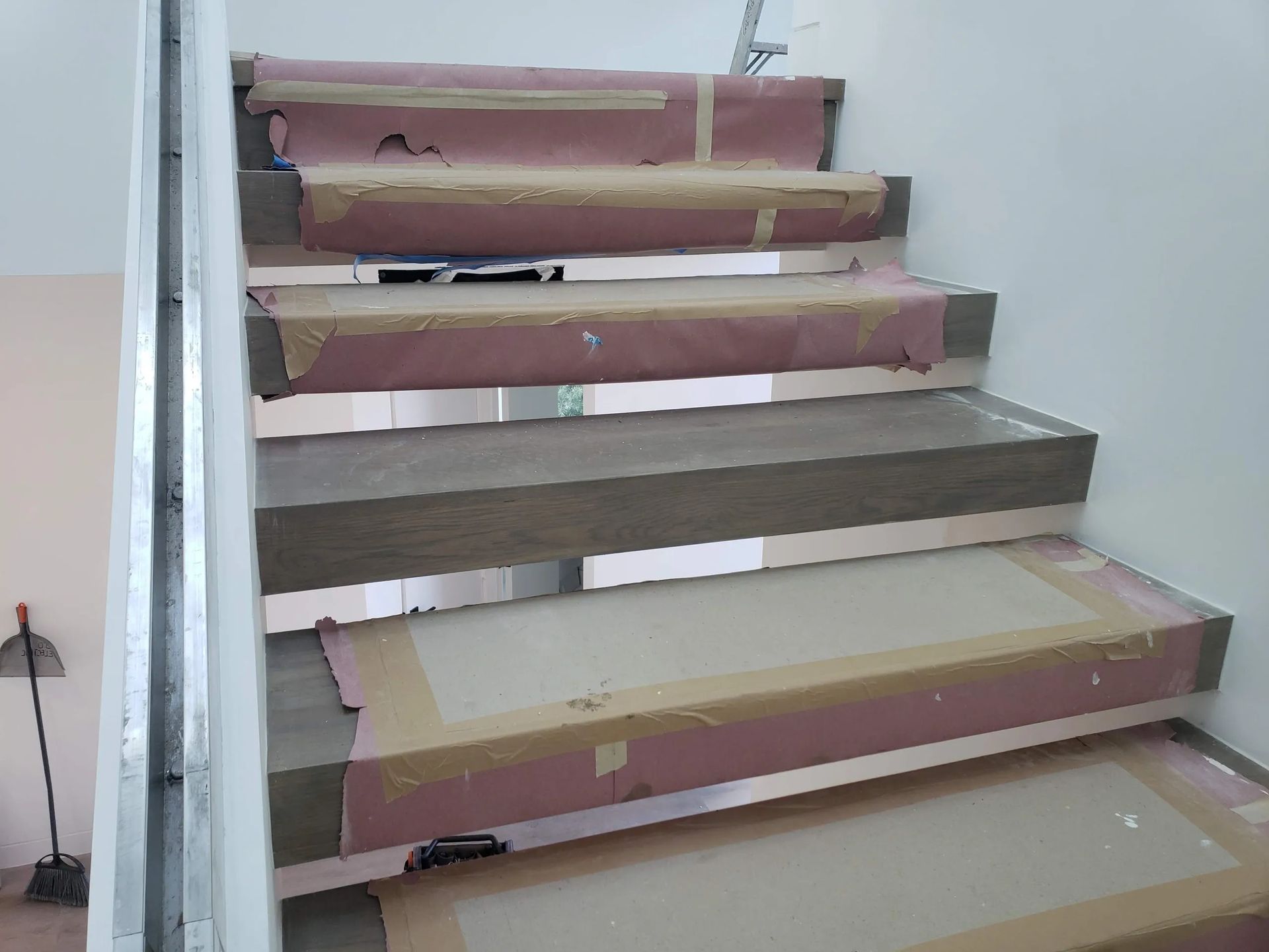 A set of stairs that are covered in paper and tape