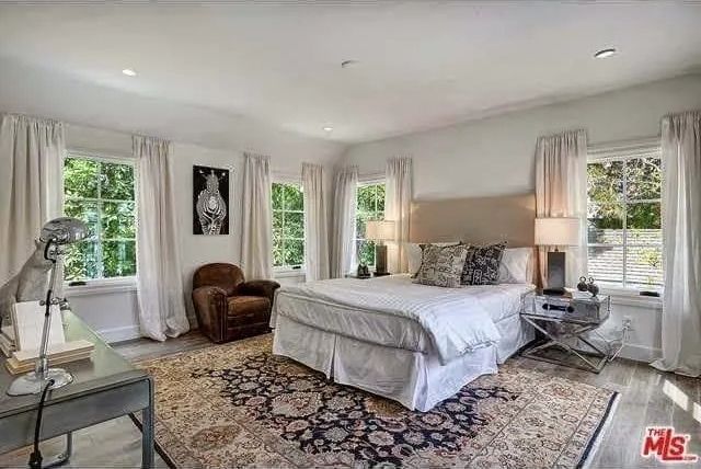 There is a large bed in the middle of the room