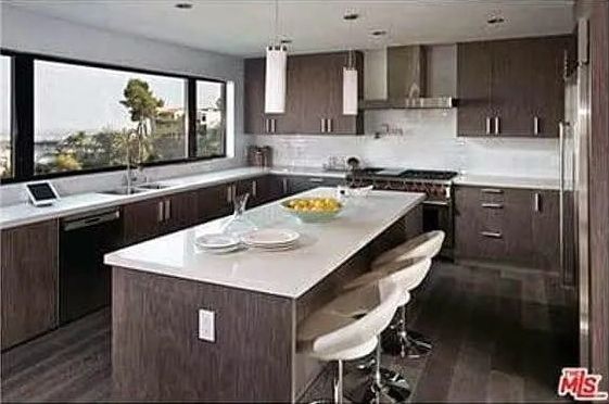 A kitchen with a large island in the middle of it