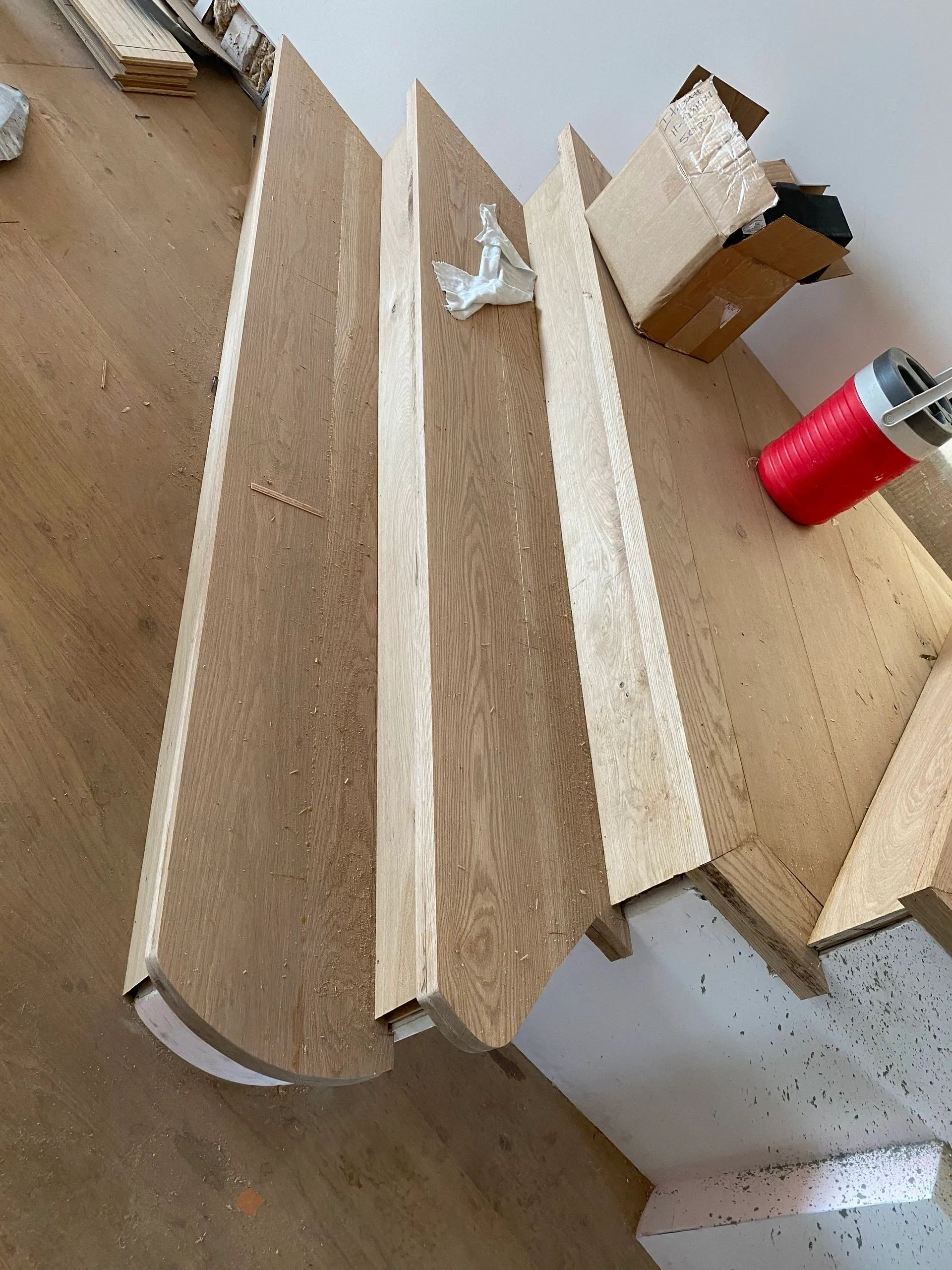 A piece of wood is sitting on top of a wooden table