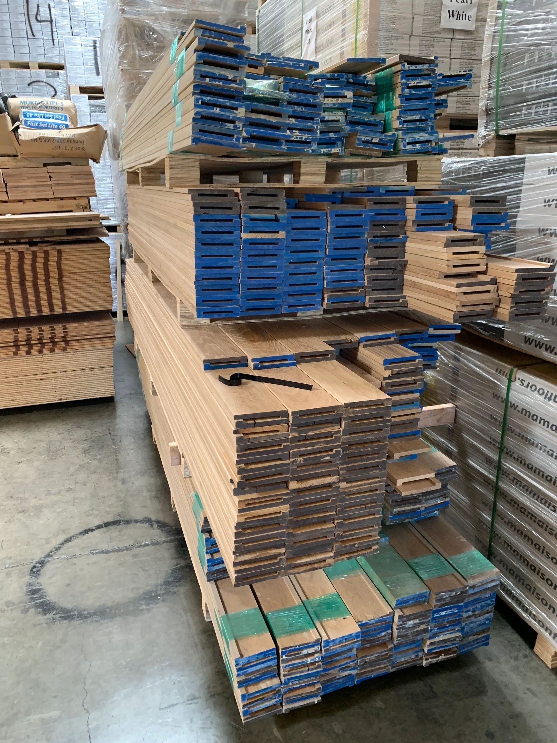 A pile of wood is stacked on top of each other in a warehouse