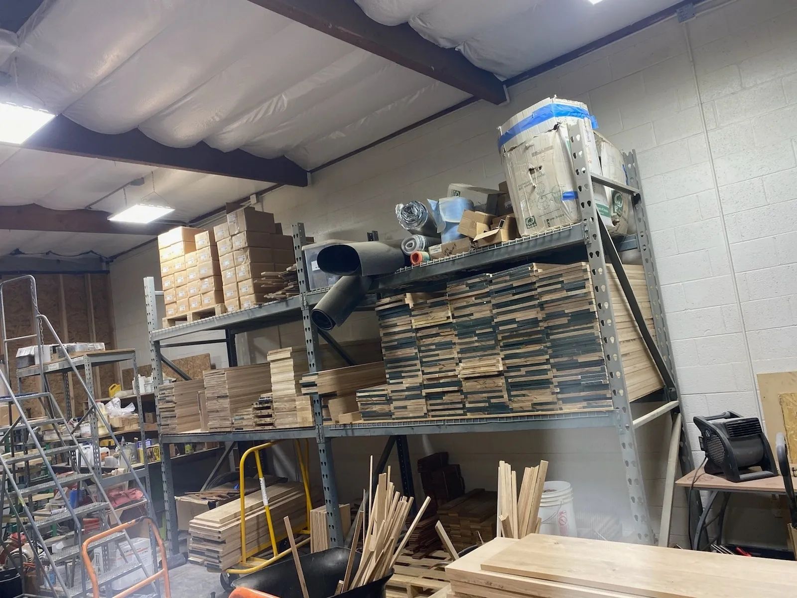 A warehouse filled with lots of wood and boxes