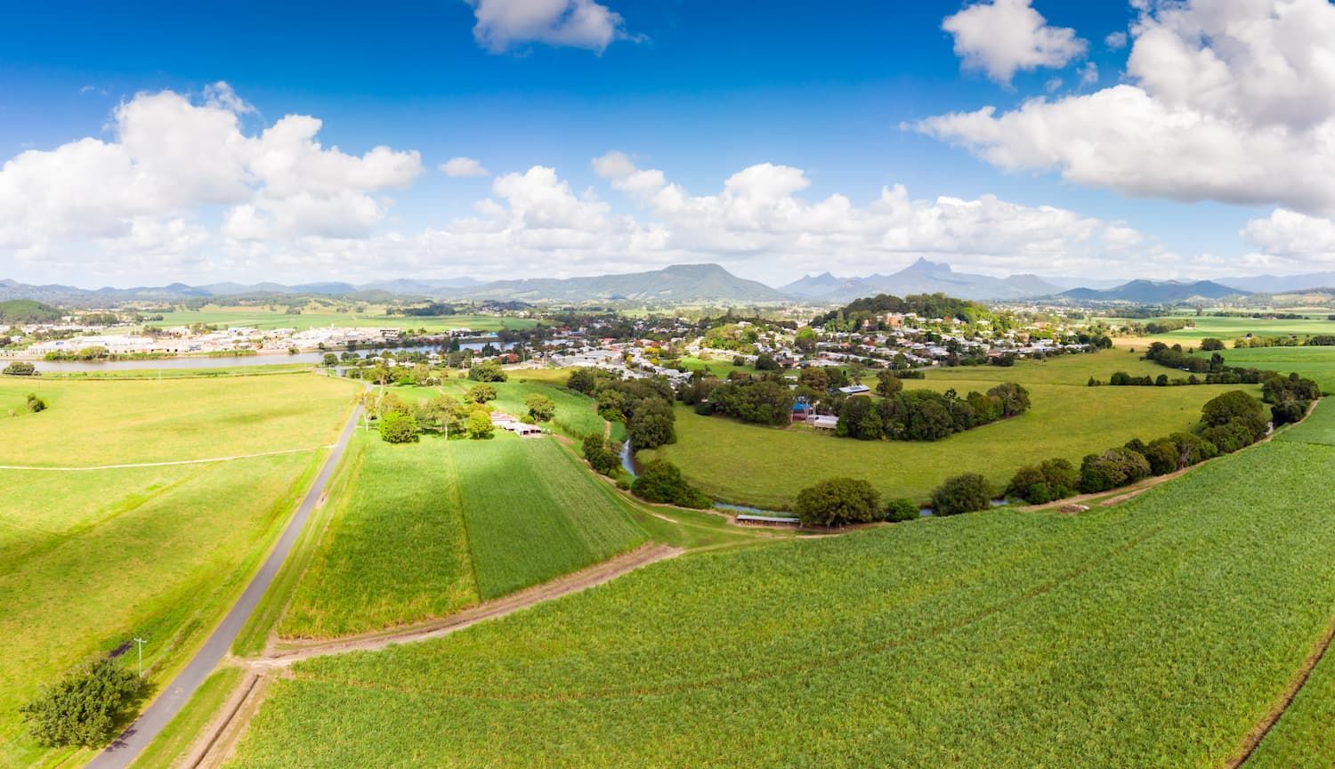 Green Fields Surround a Small Town Under a Bright Blue Sky — Sew Affordable In Wyee, NSW