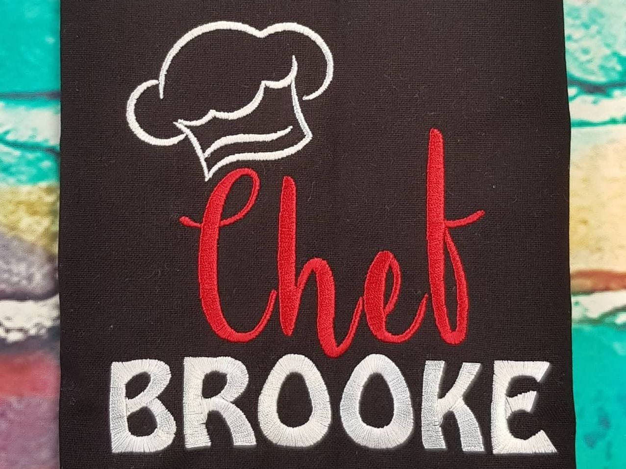 Black Fabric with Embroidered Chef Hat — Sew Affordable In Toukley, NSW
