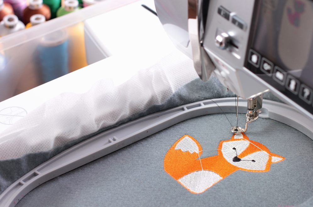 Embroidery Machine Stitching a Small Orange and White Fox — Sew Affordable In Wyee, NSW