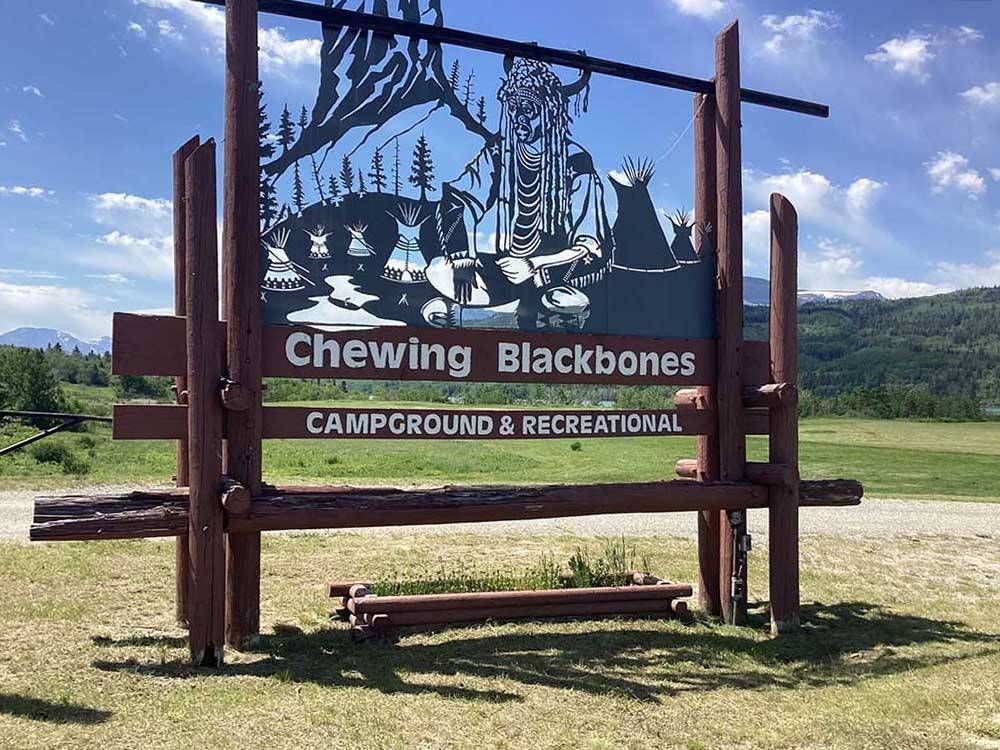 A wooden sign for chewing blackbones campground and recreationalicon