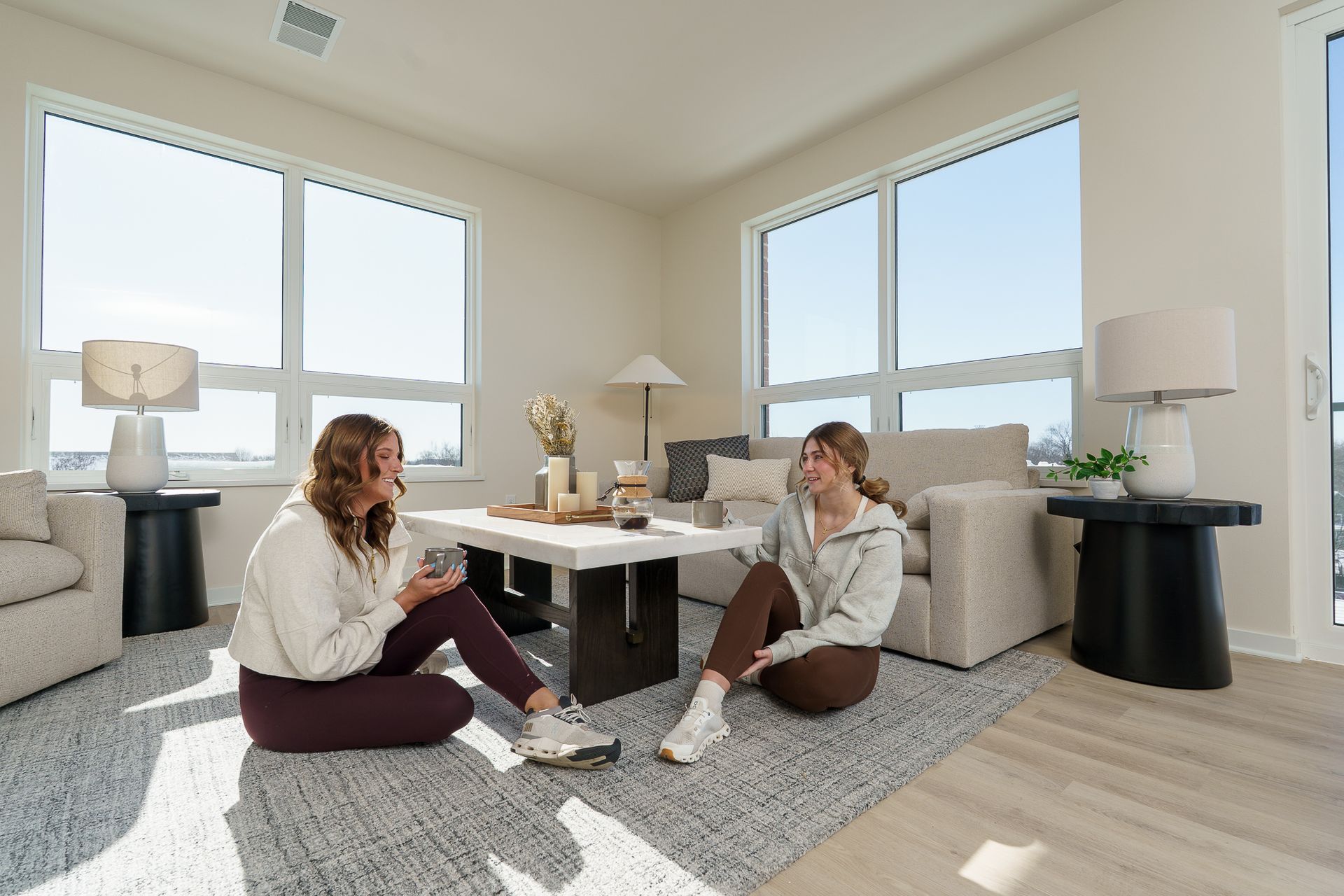 Photo of two people sitting on the floor